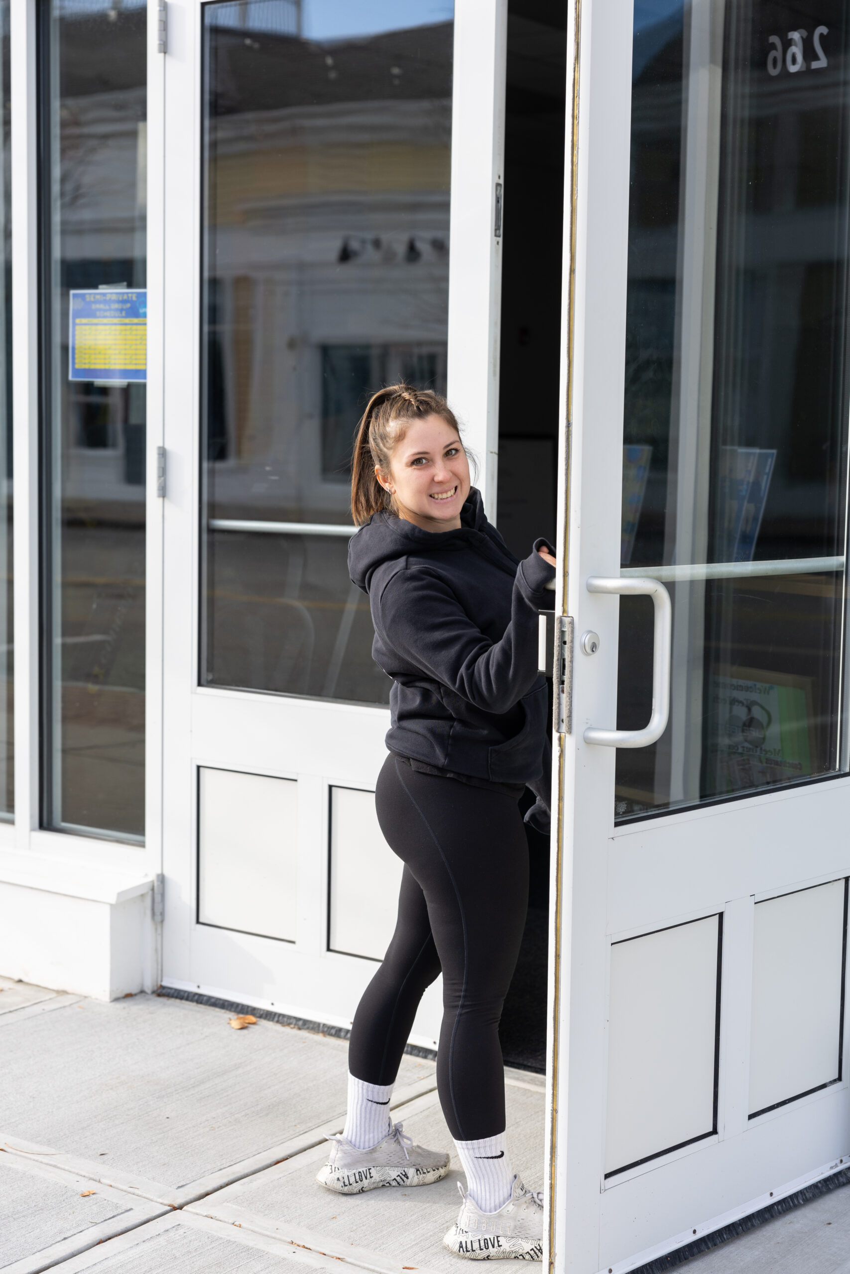 Curtis in front of the zip code mural