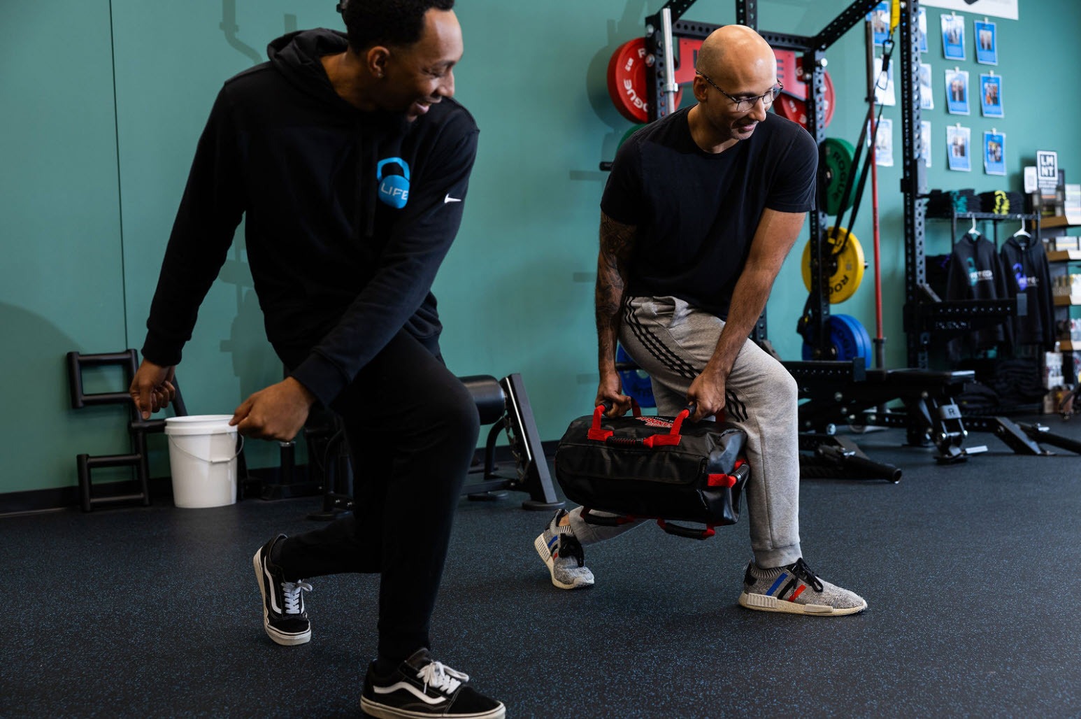 personal trainer coaching adult client during strength training session at Life Techs Fitness Wayland MA